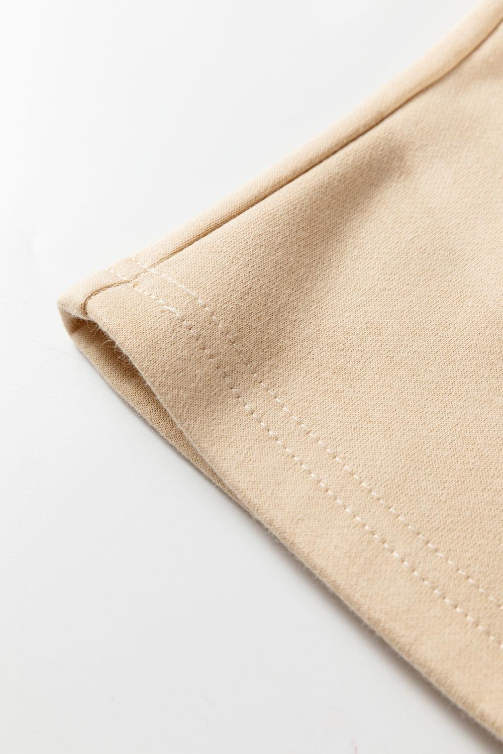 Oatmeal pant hem with stitched cuff edge detail