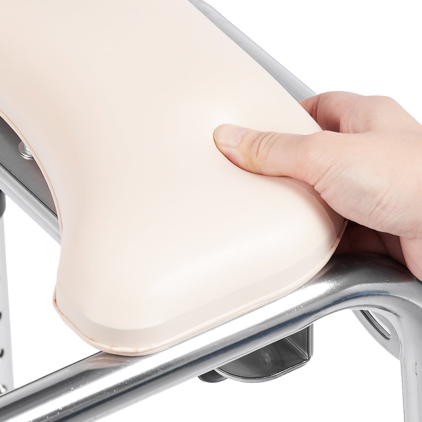 Beige padded commode chair seat cover with curved opening and reinforced edges