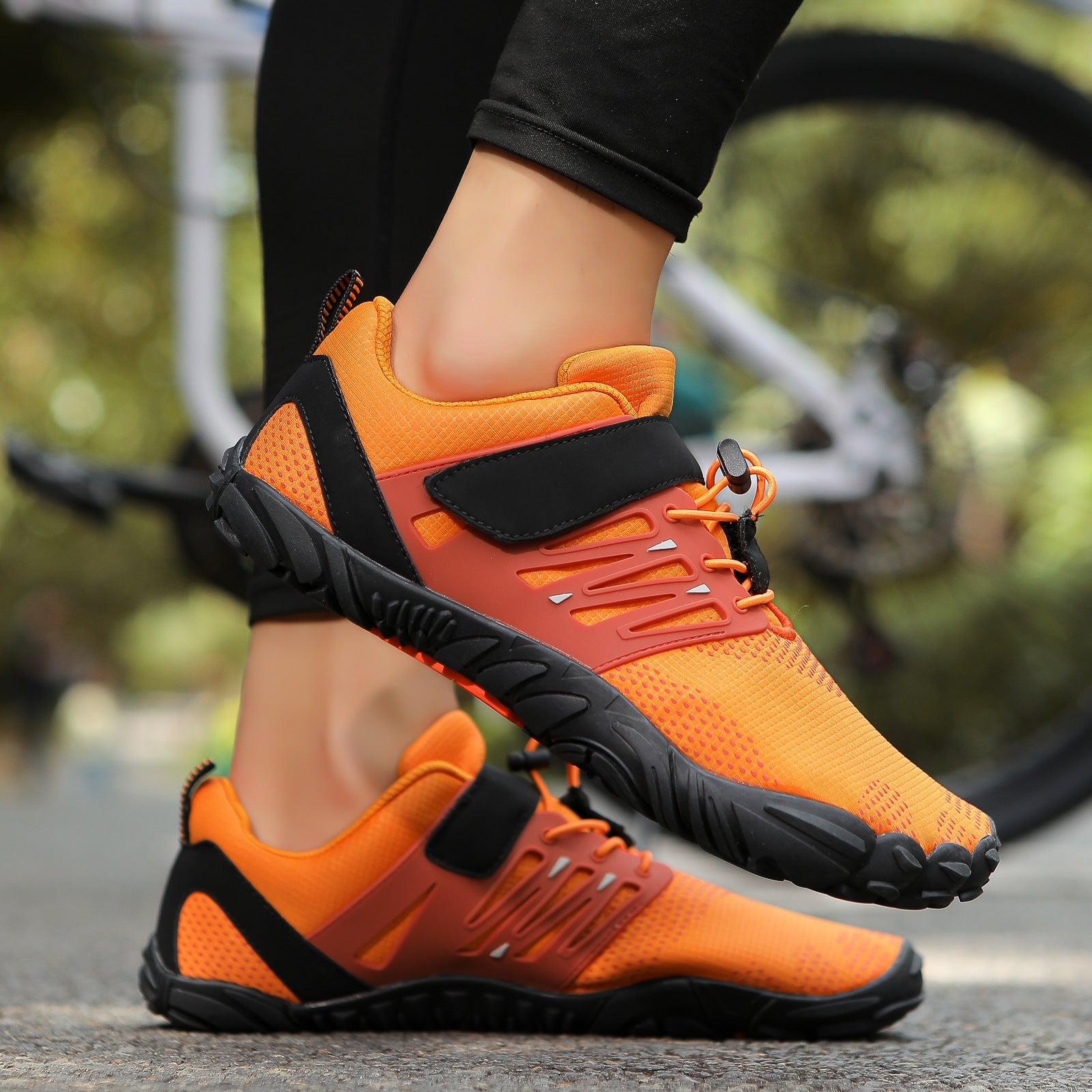 Orange dive water shoes with black strap, lace-up front, and rugged tread sole