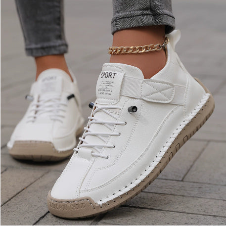 White casual leather ankle boots with lace-up front and rubber platform sole