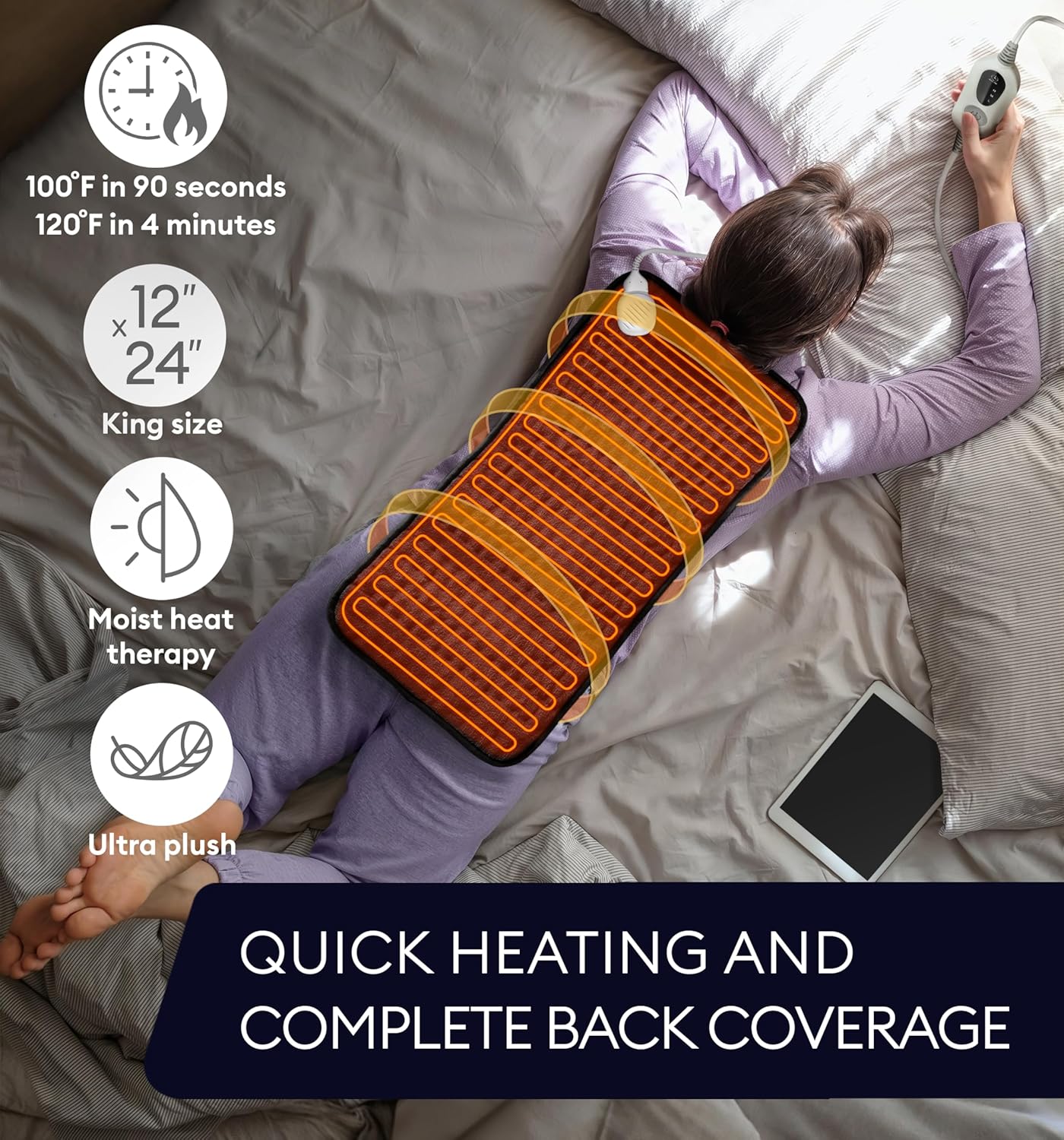 Large black heating pad with controller, placed on bed for full back coverage