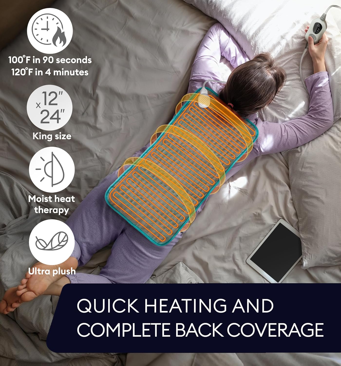 Viridian green XL heating pad on bed with controller connected to cord