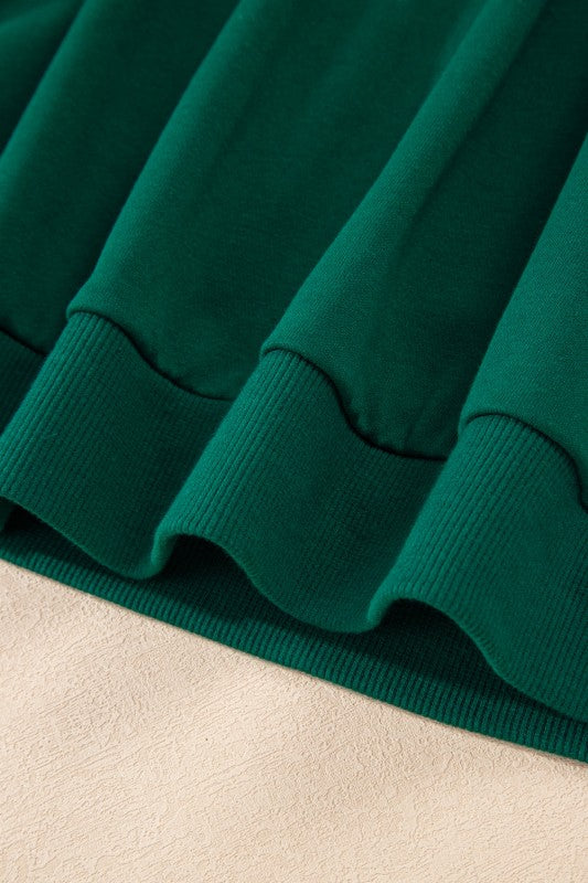 Green mini skirt with ribbed hem and slight flare