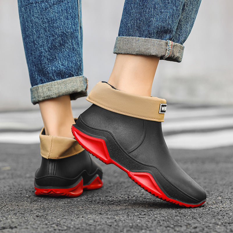 Men's short rain boots, black with red accents and tan cuff, slip-on ankle style