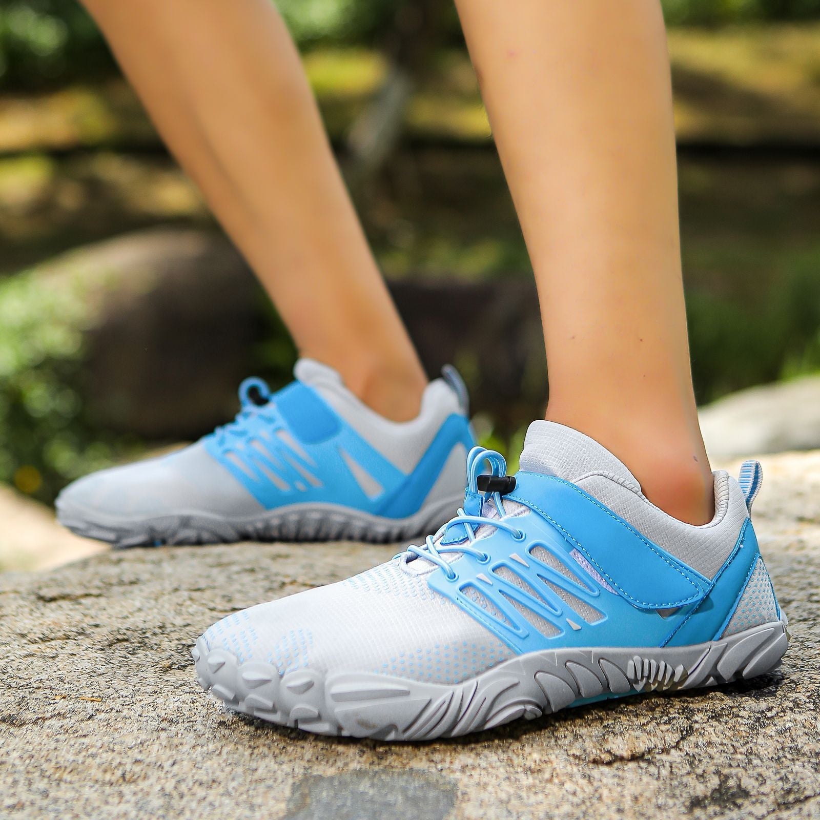 Light blue water shoes with lace-up closure and thick tread sole for grip