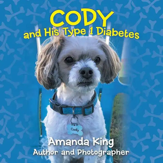 Paperback book with cover featuring a small white dog wearing a blue collar