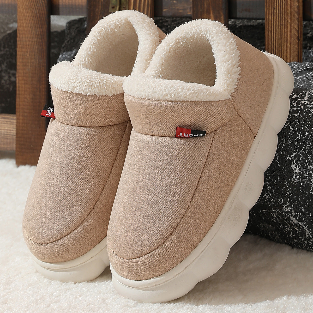 Khaki plush house shoes with fuzzy strap and thick white sole, back view