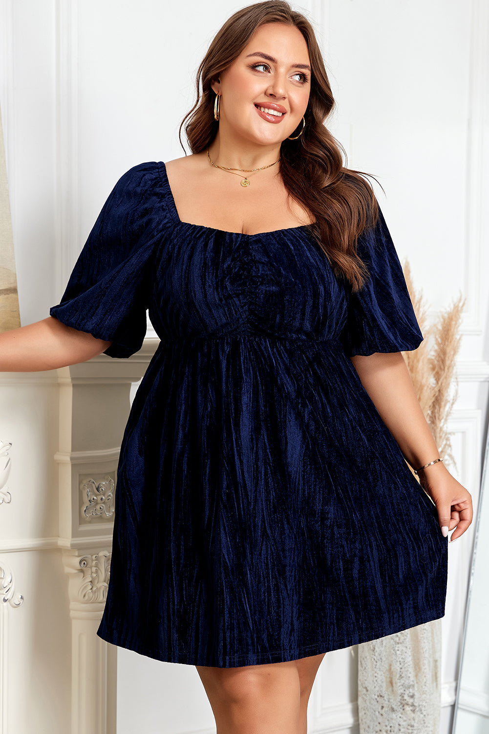 Navy blue short puff-sleeve dress with square neckline and cinched waist