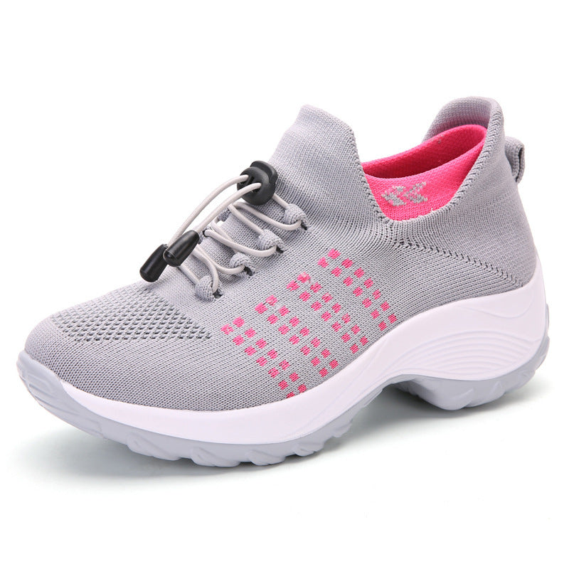 Light gray knit athletic sneaker with hot pink accents, lace-up and white cushioned sole