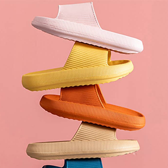 Stacked slide sandals in pink, yellow, and orange with wide textured straps