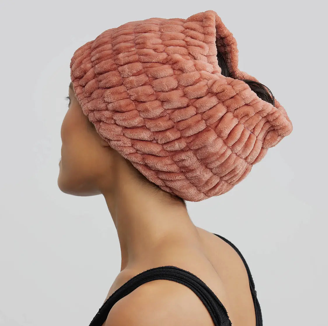 Dusty rose spa headband with thick plush terry texture, curved wrap design