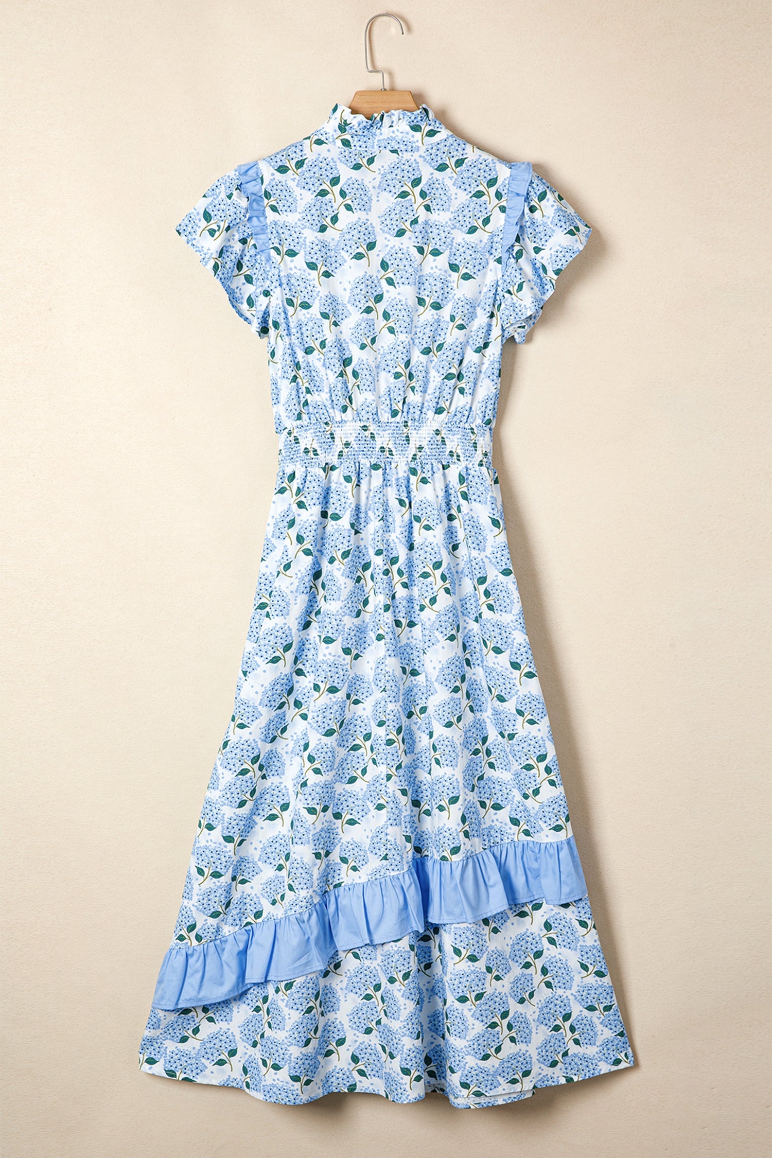 Sky blue long dress on hanger, flutter sleeves and tiered ruffle hem with floral print