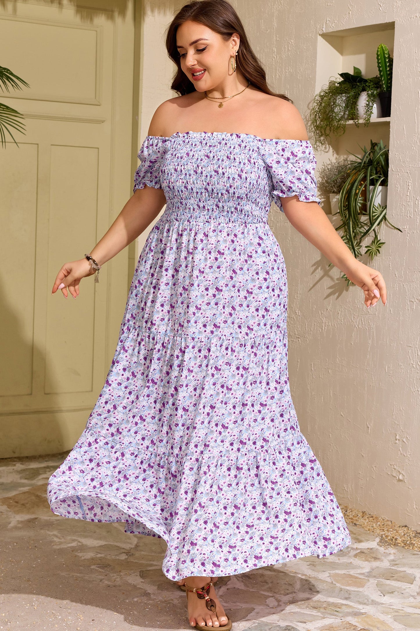 Purple floral smocked maxi dress with square neckline, puff sleeves, and flowing tiered skirt