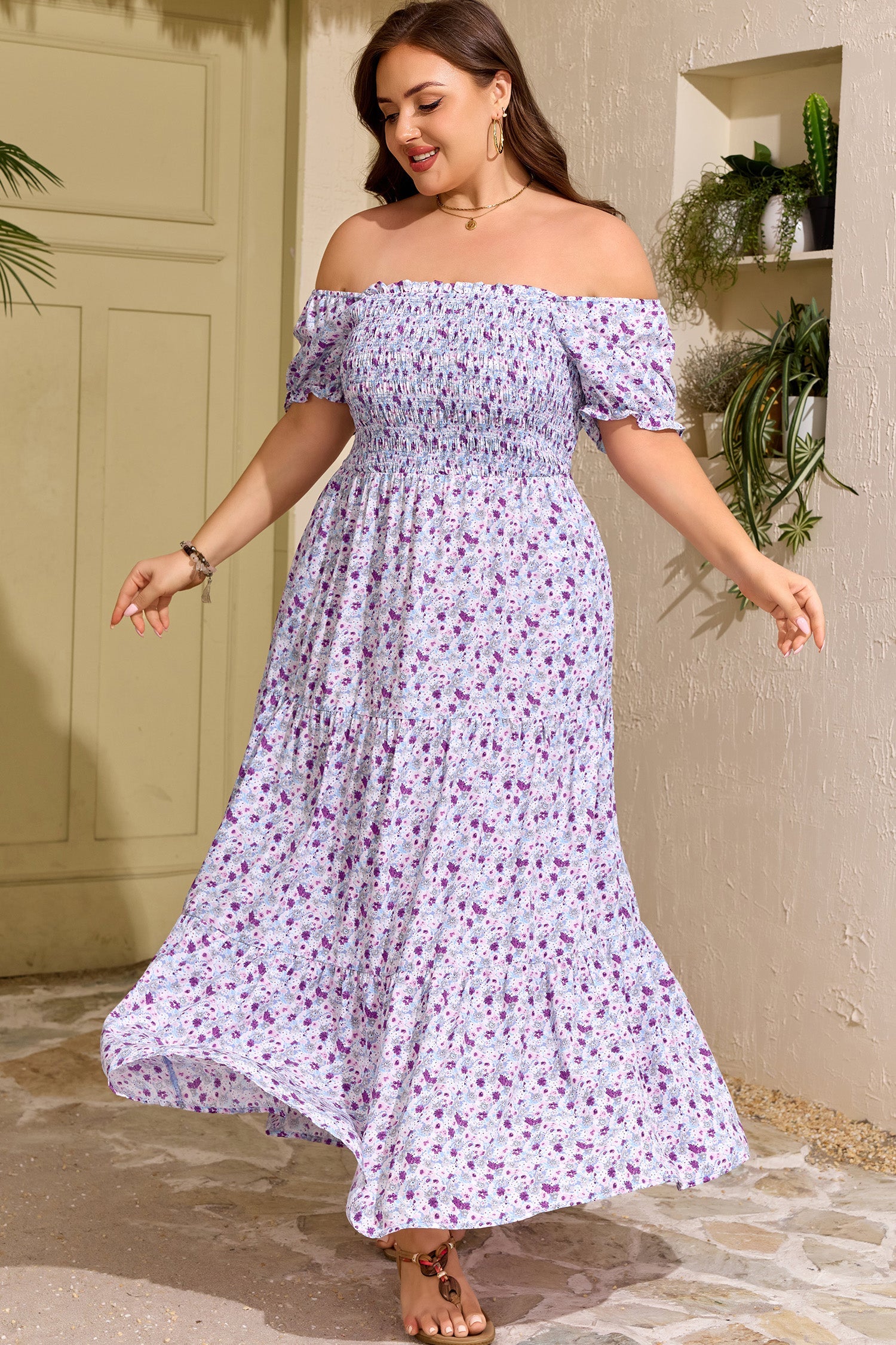 Purple floral smocked maxi dress with square neckline, puff sleeves, and flowing tiered skirt
