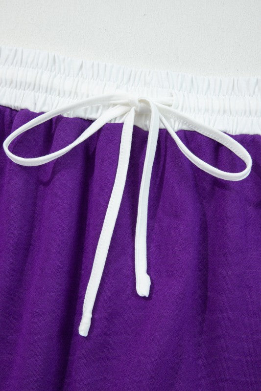 Purple mini skirt waistband with white drawstring ties and elastic