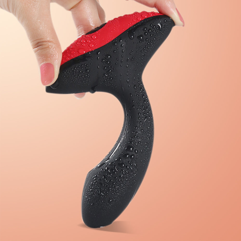 Close-up of black silicone anal massager with textured grip and red accent band