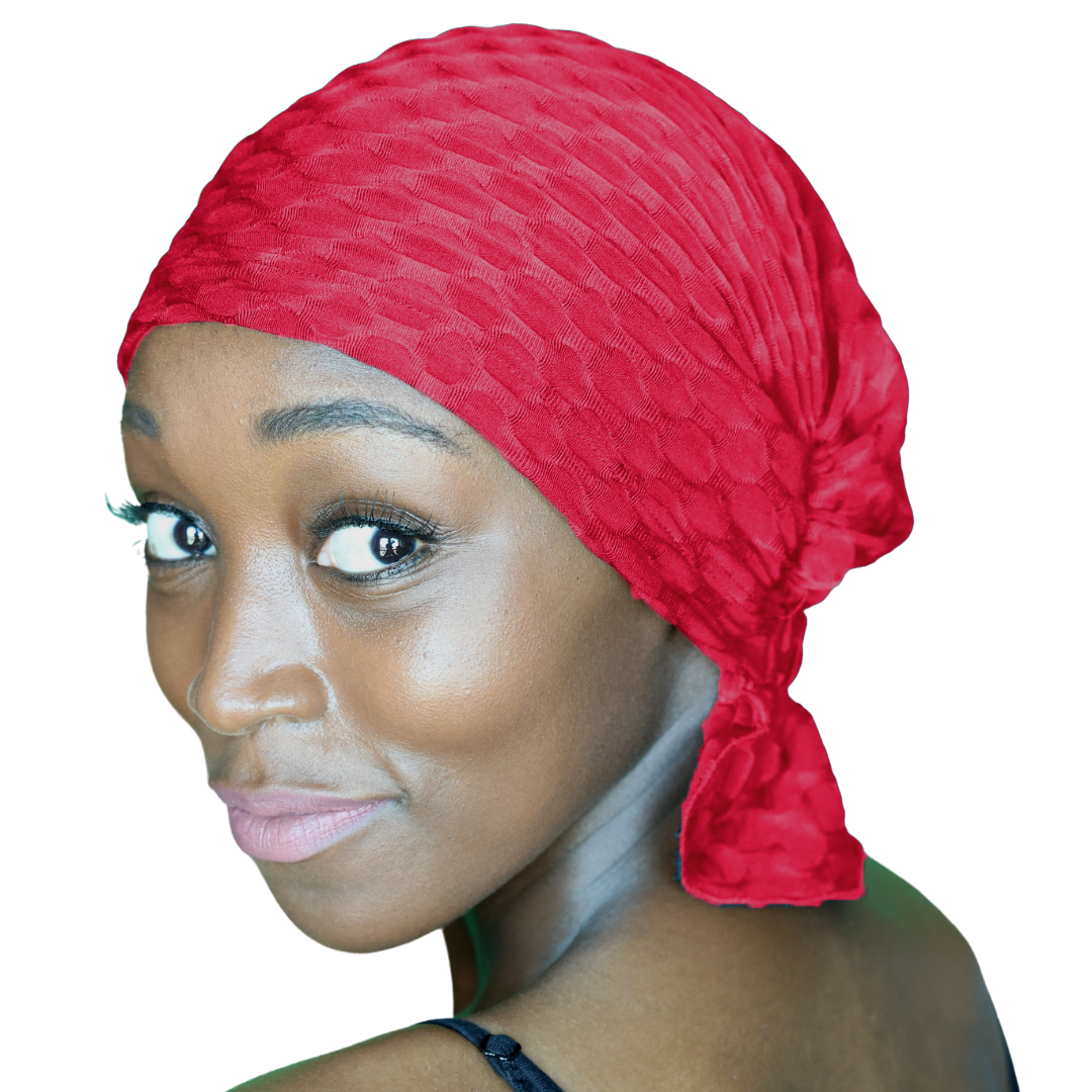 Red chemo beanie with textured knit and draped side tail