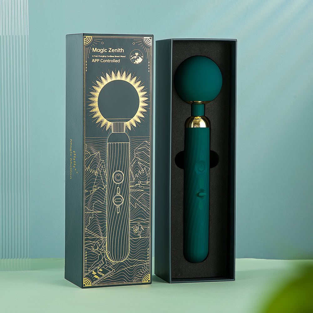App-controlled massage wand in open packaging, dark teal body with round head
