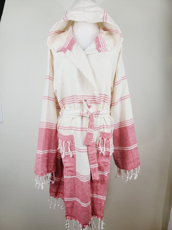 Unisex hooded bathrobe with cream base and pink stripes, tie belt, and tassel-edged sleeves and hem.