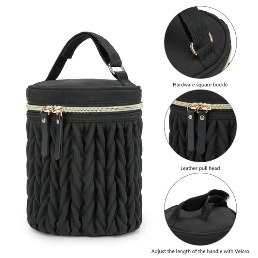 Black insulated baby bottle bag with carry handle, gold-tone zipper, quilted sides