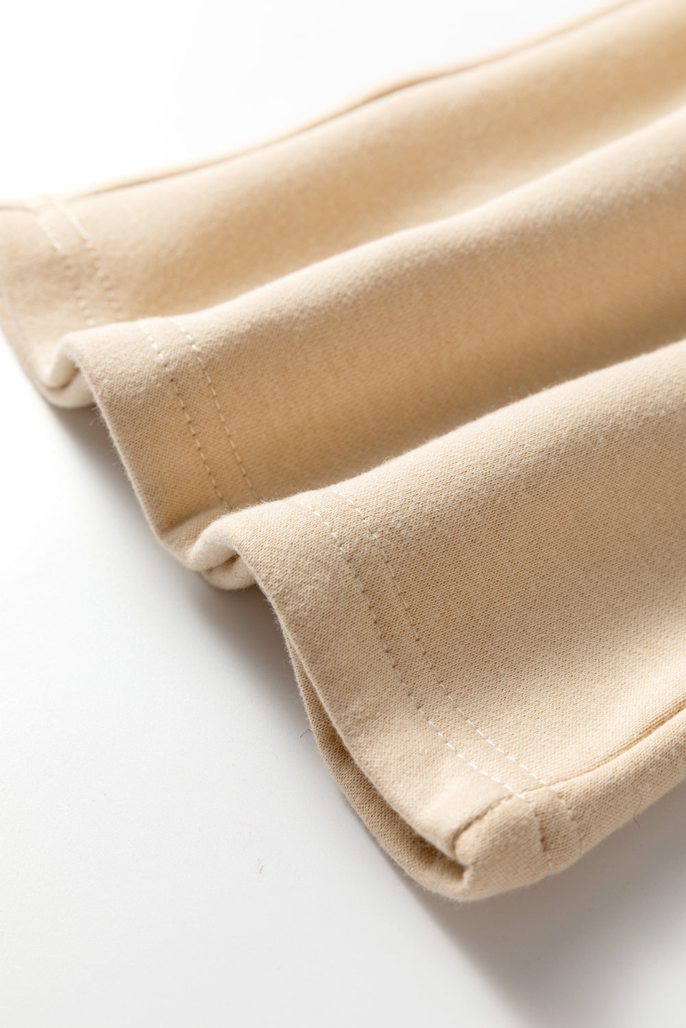Oatmeal ankle cuffs with stitched hem edge