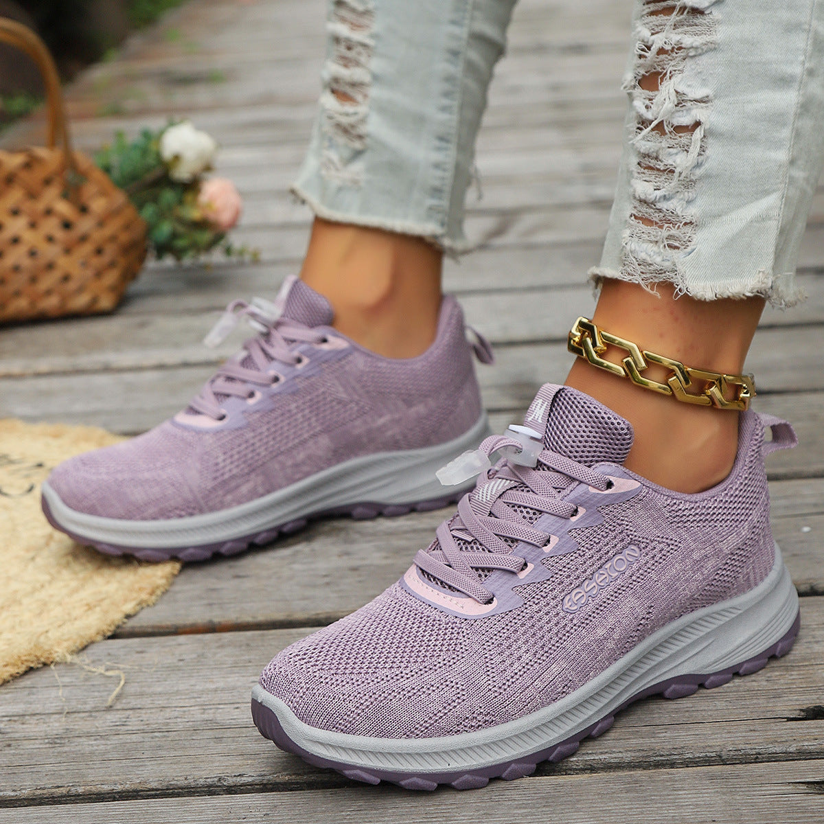 Purple knit lace-up travel running shoes with cushioned white sole