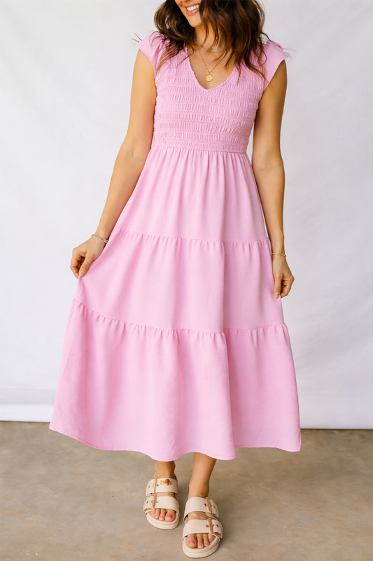Pink tiered midi dress with smocked bodice and cap sleeves