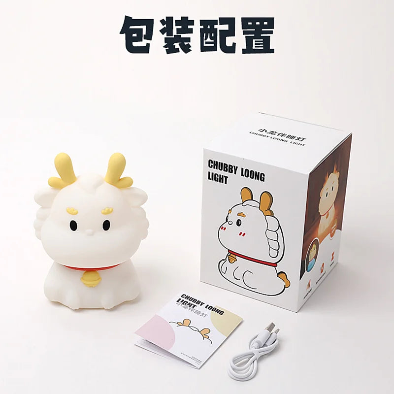 White dragon night light with box packaging, charging cable, and instruction card
