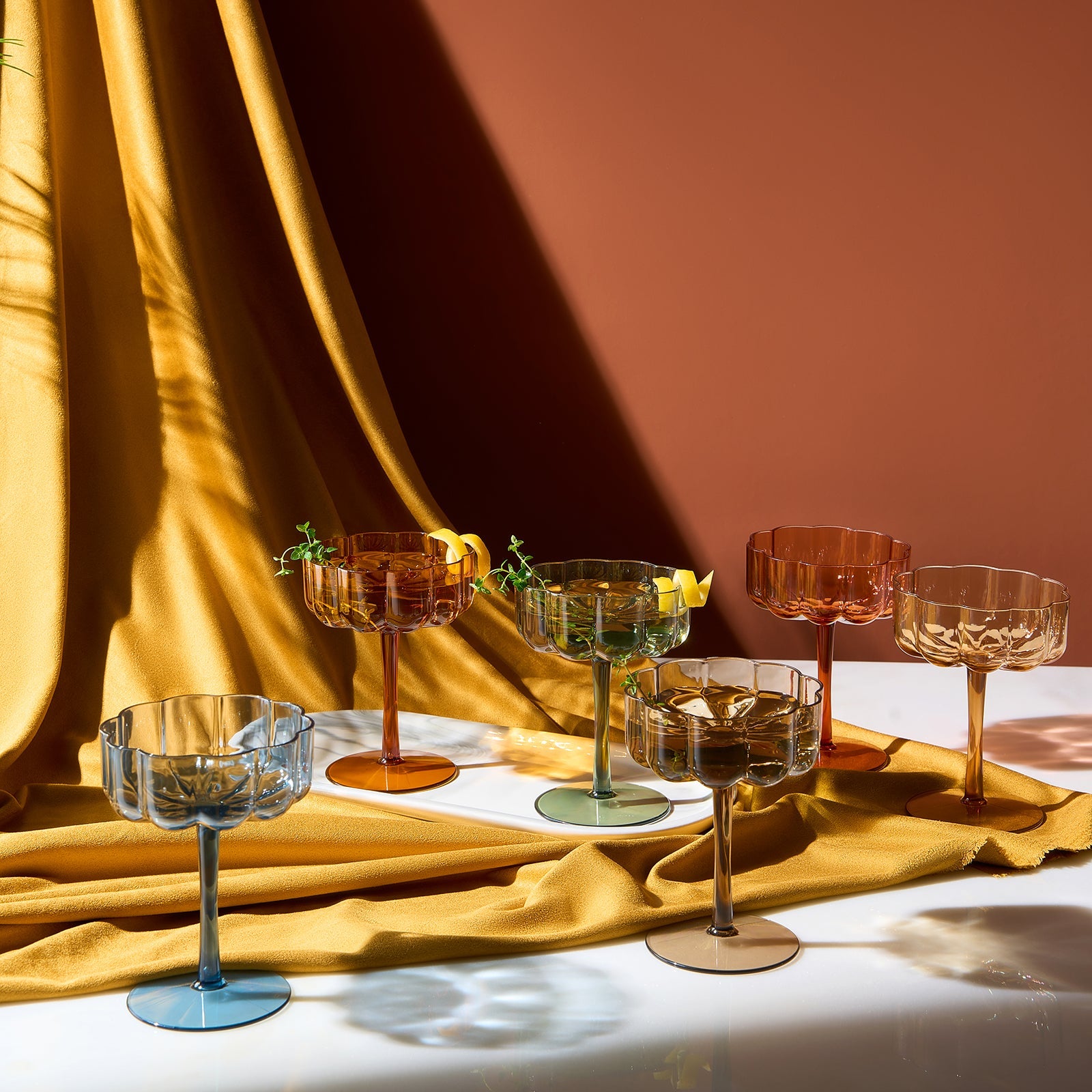 Set of 6 acrylic champagne coupe glasses with amber and clear bowls on long stems