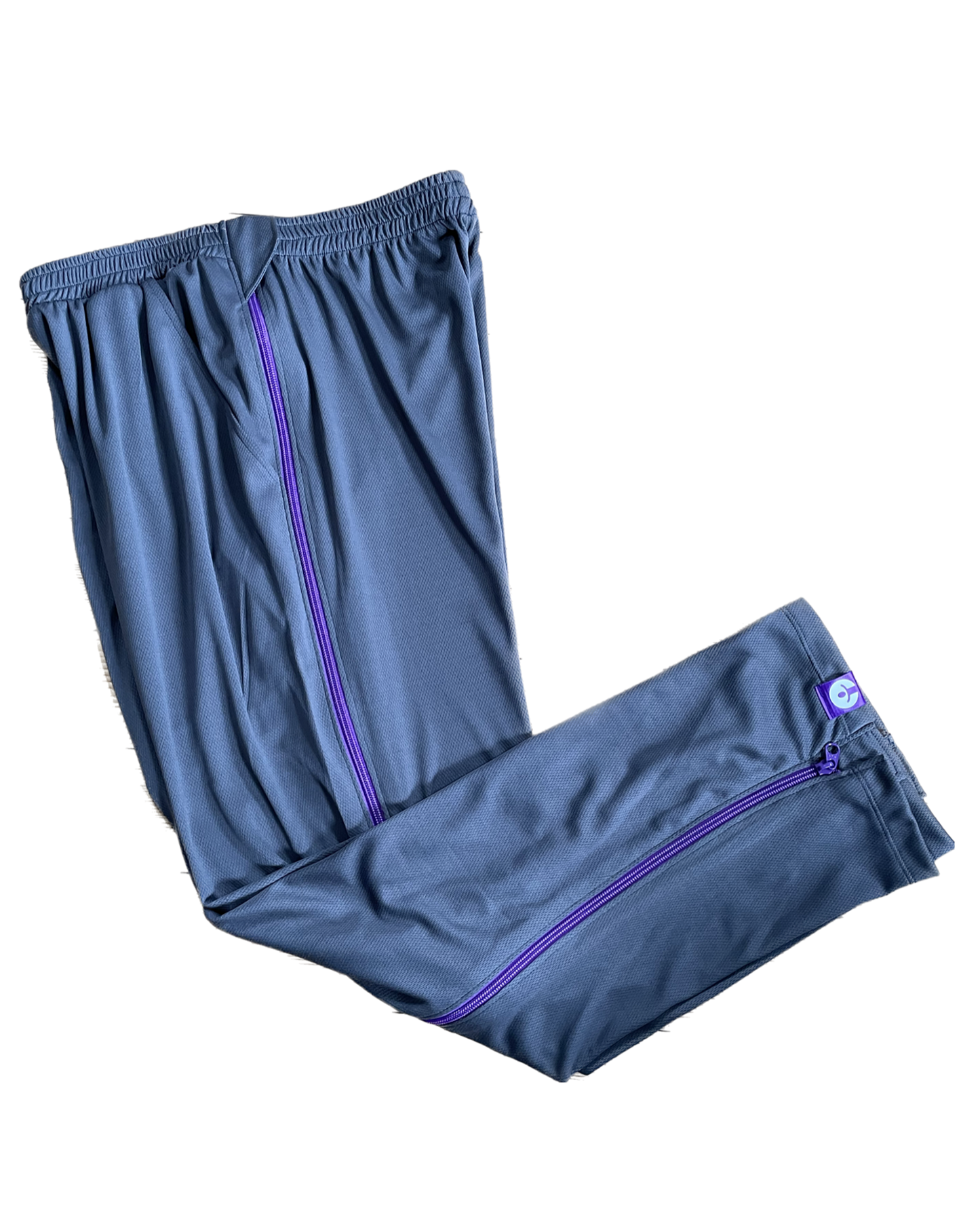 Blue athletic pants with purple accents on a white background
