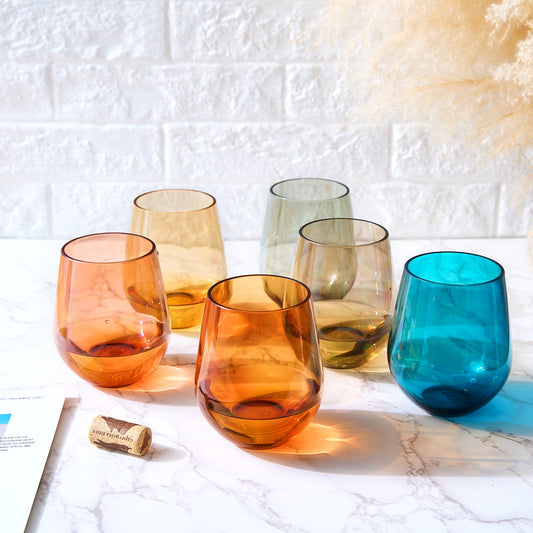 Set of 6 stemless acrylic wine glasses with assorted amber, orange, and blue hues