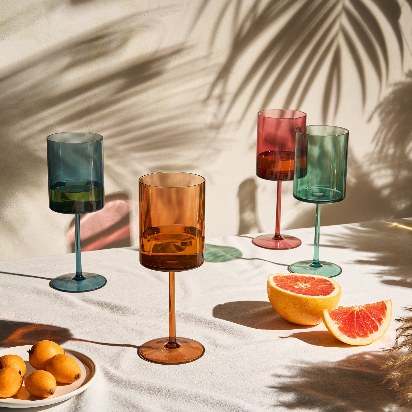 Acrylic stemmed wine glasses set: blue, amber, red, and green tinted goblets