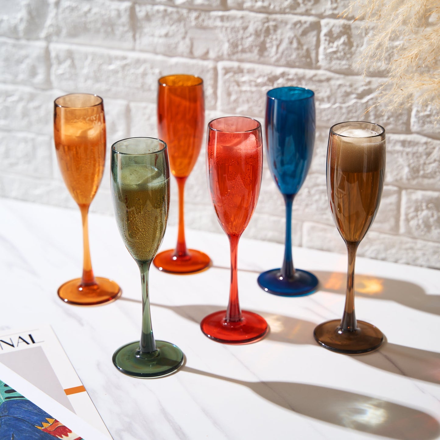 Assorted acrylic champagne flutes, orange red green blue tan and amber, set of 6.