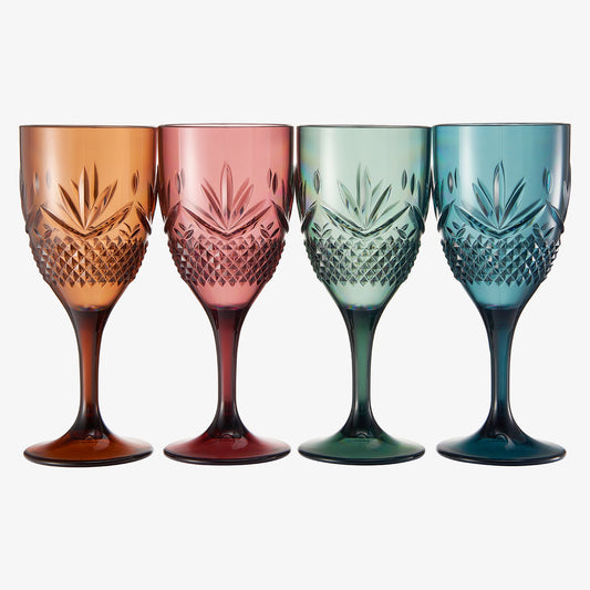 Set of four stemmed wine glasses, amber, pink-red, green, and blue, faceted sides