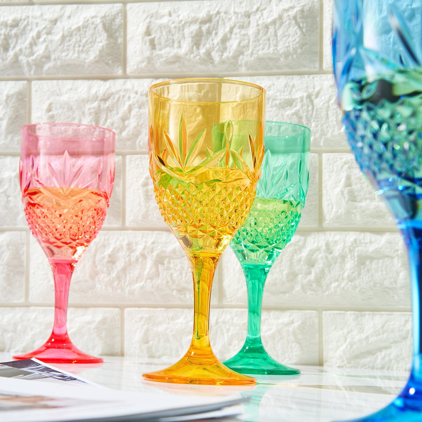 Stemmed acrylic wine glasses with faceted cut; pink amber green blue (partial set of 4)