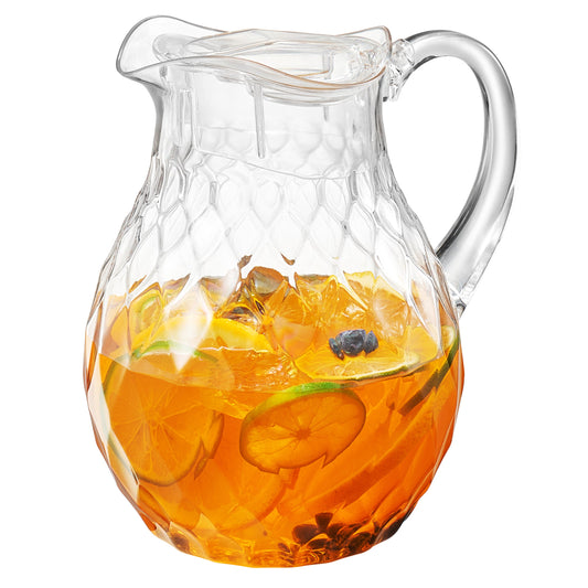 Amber acrylic pitcher with clear diamond texture, curved handle, filled with orange drink