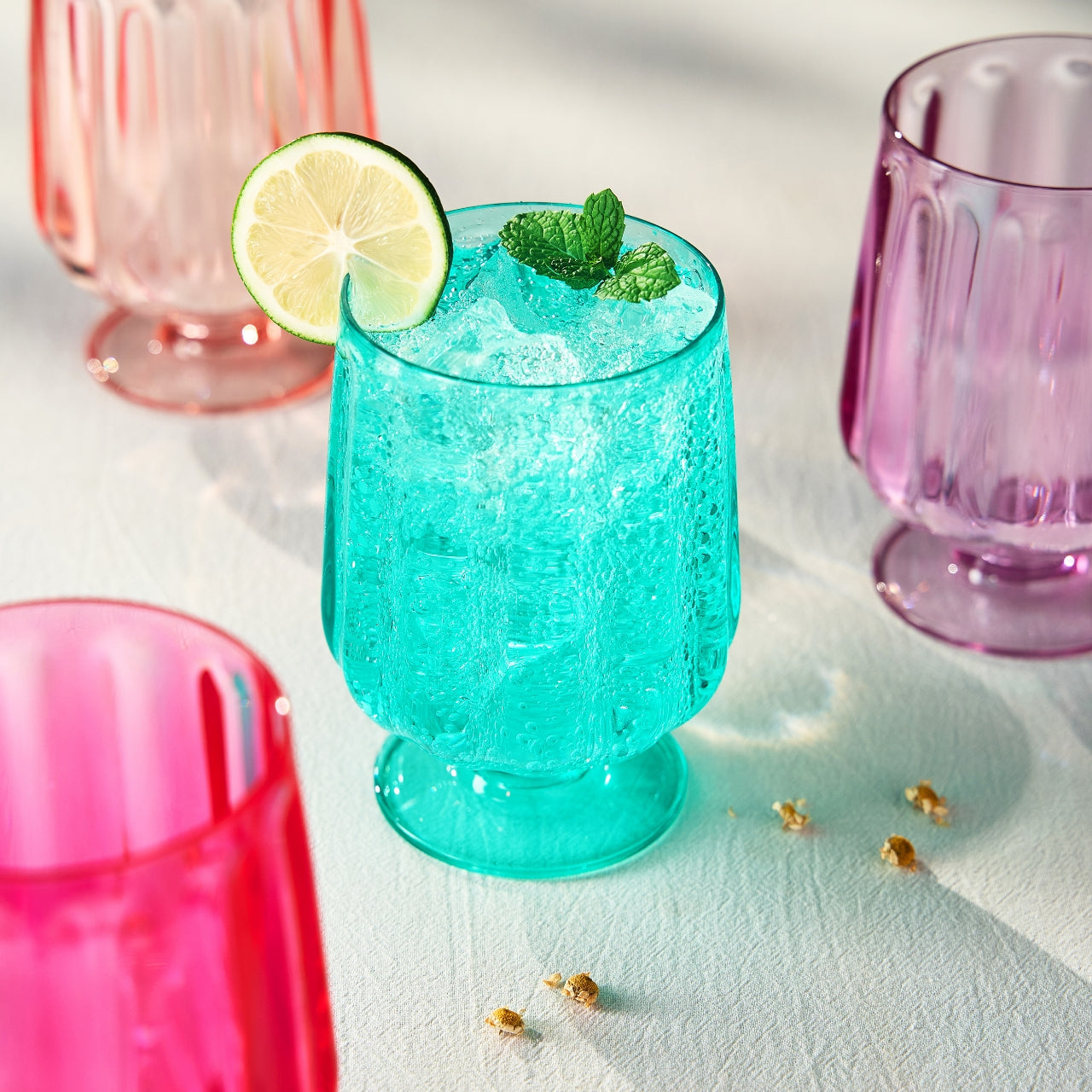 Acrylic stemmed wine goblet, teal, ridged sides and clear stem