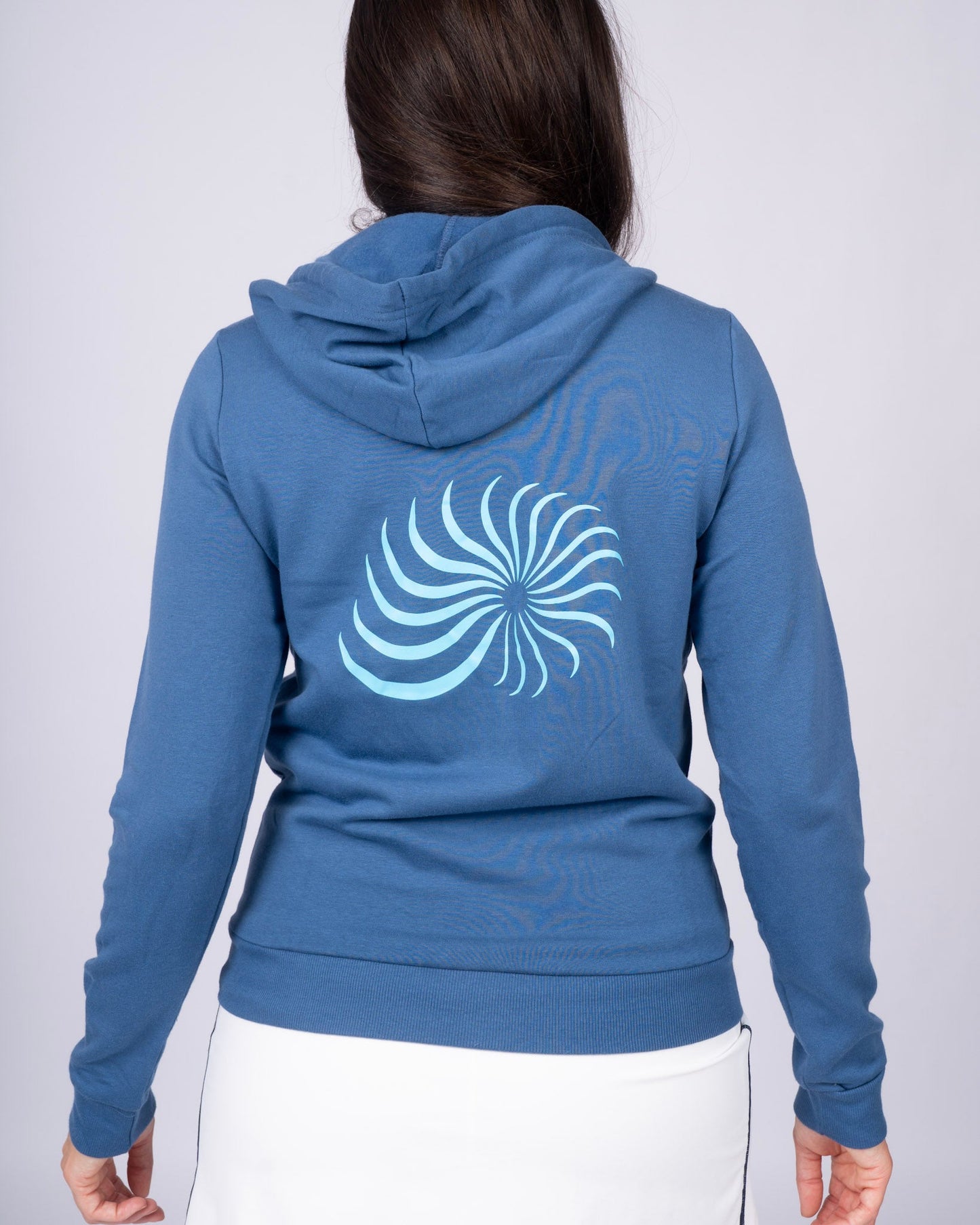 Blue zip hoodie back view with hood and large swirl graphic across the upper back.