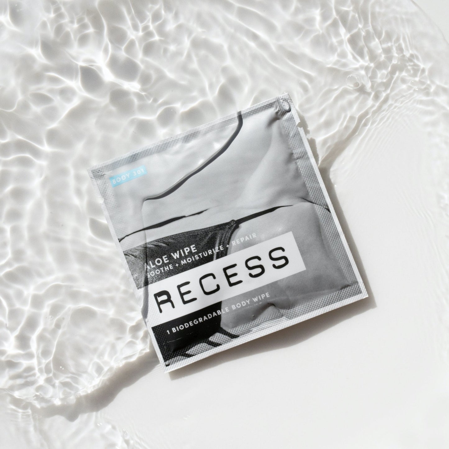 RECESS body wipe package on a light background