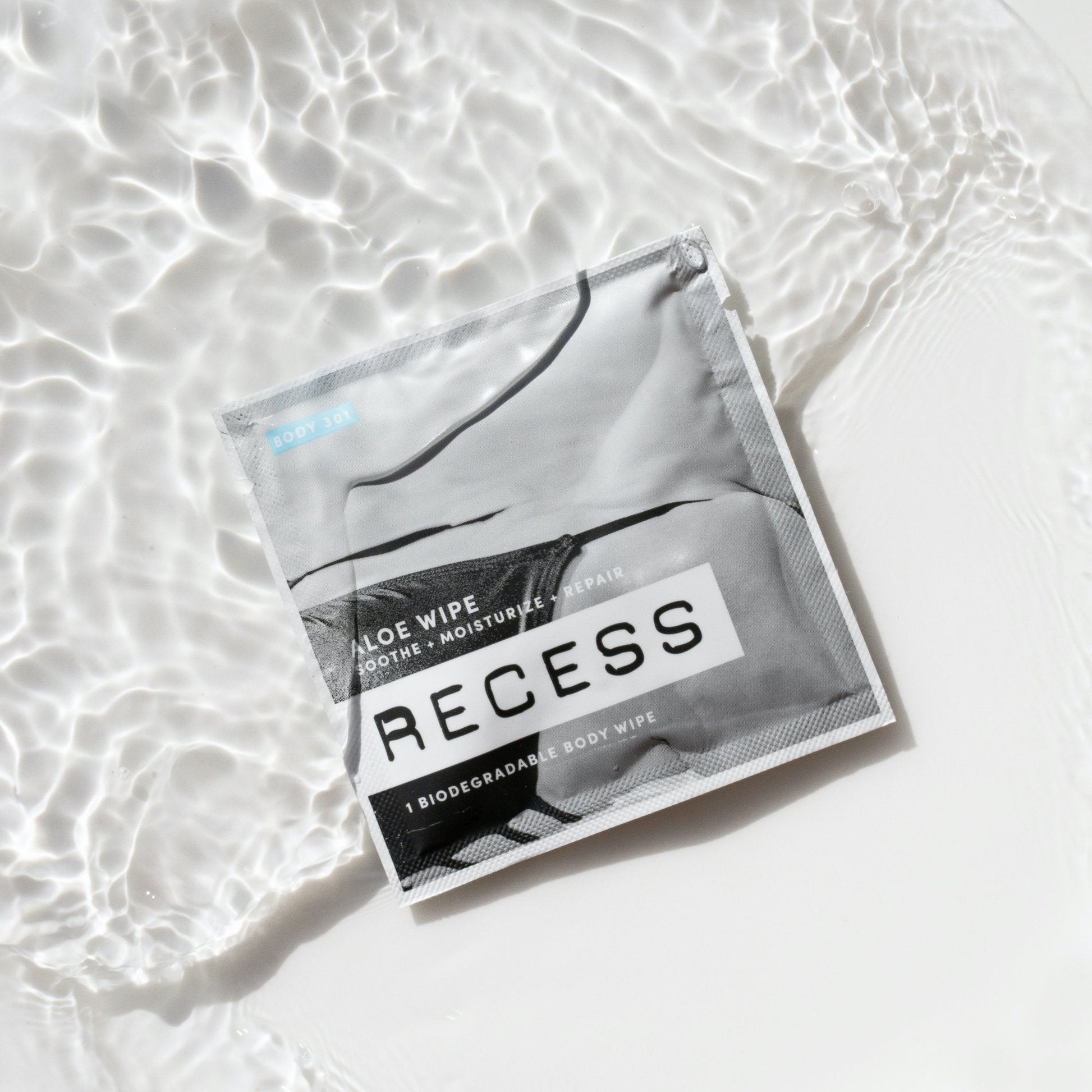 RECESS body wipe package on a light background