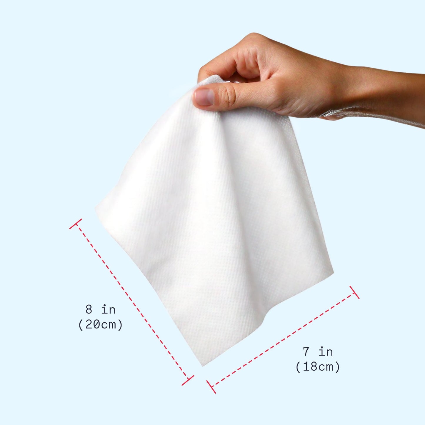 Hand holding a white square napkin with dimensions labeled on a light blue background