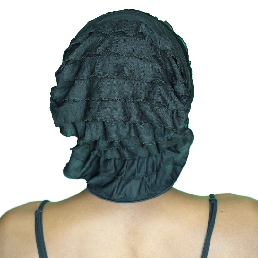 Dark teal ruffled chemo beanie, back view with tiered seams