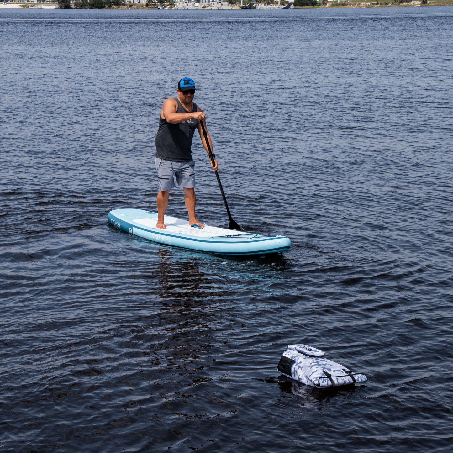 Light gray waterproof shorts on wearer, side zip pocket visible