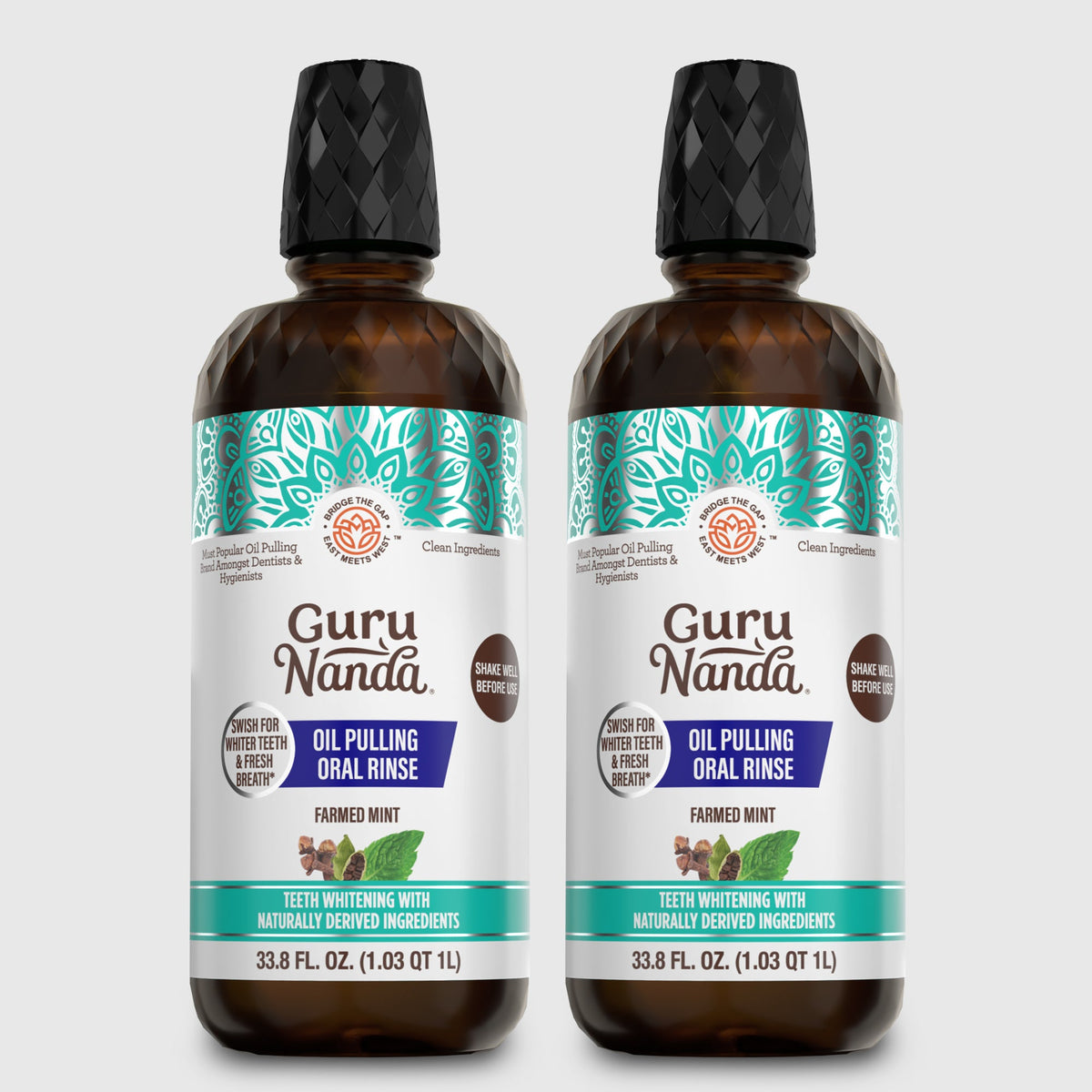 Two amber oil pulling oral rinse bottles with black caps and teal mint label front.