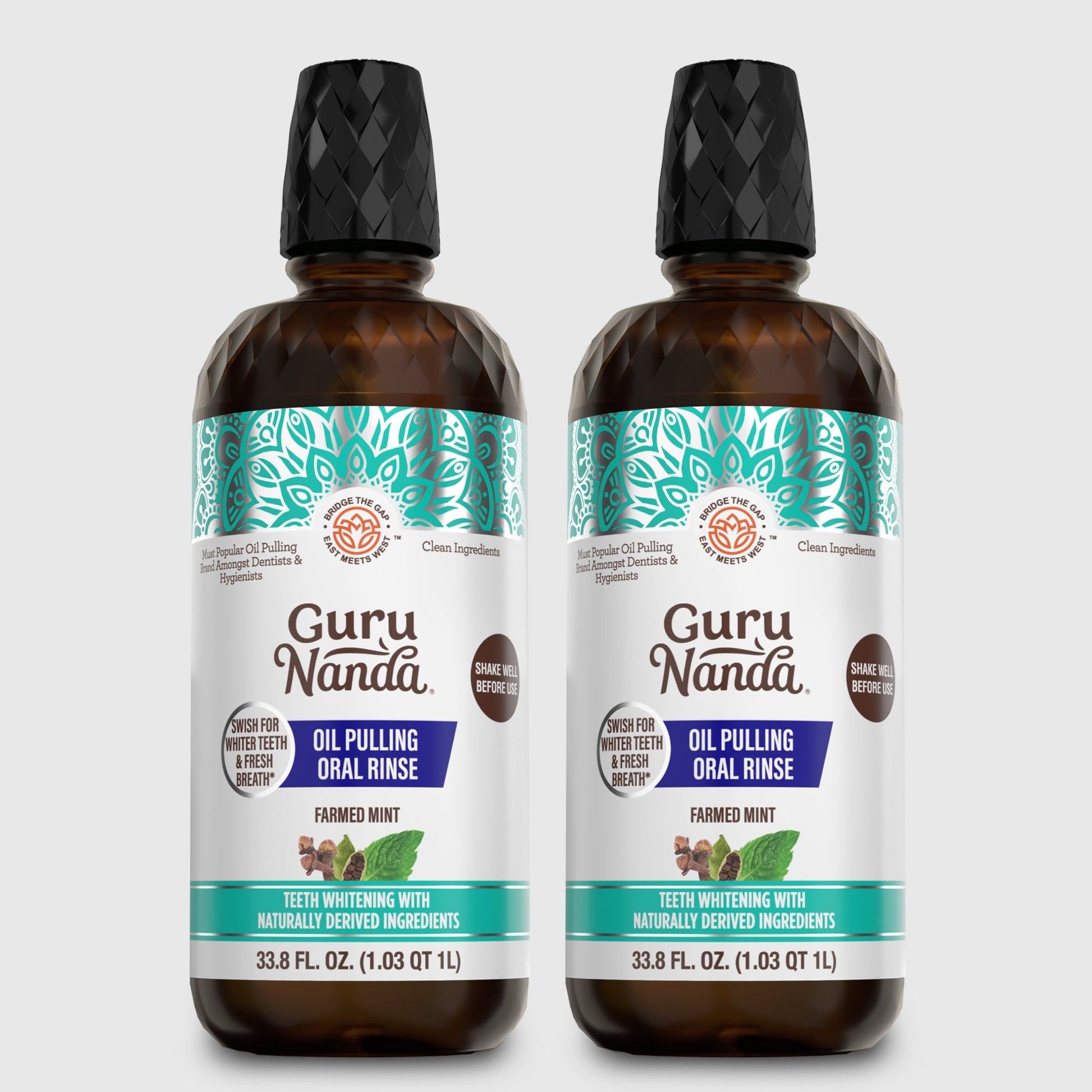 Two amber oil pulling oral rinse bottles with black caps and teal mint label front.