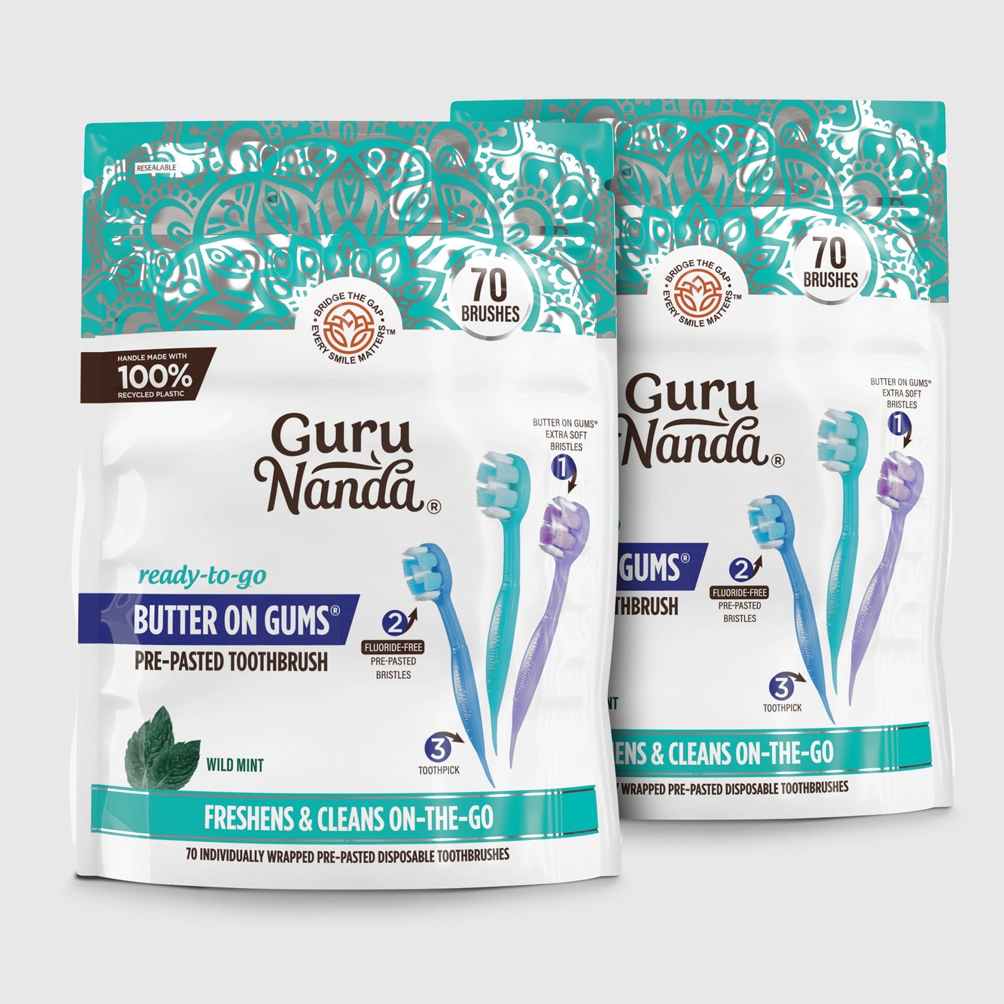 Two pre-pasted disposable toothbrush packages with teal and white graphics