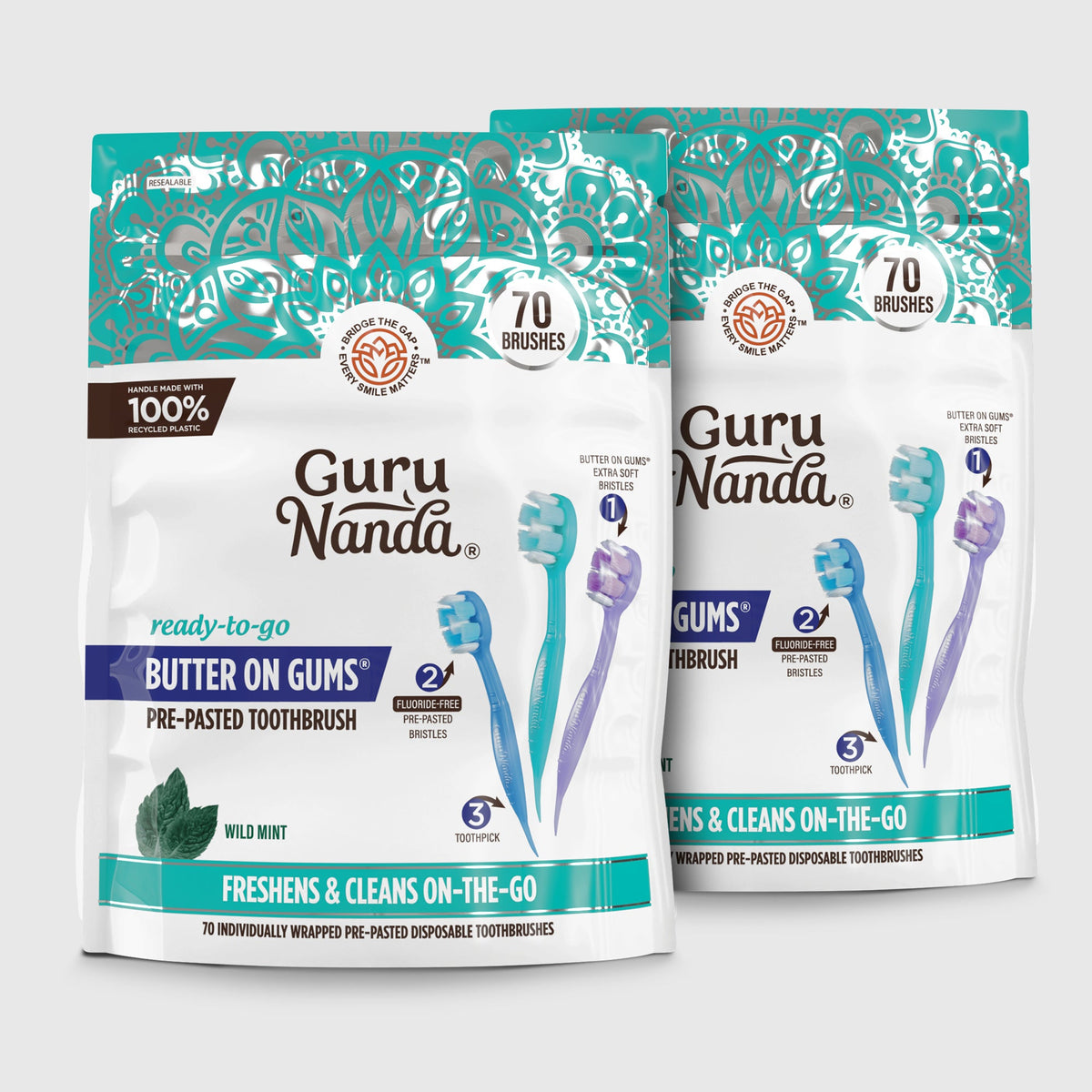 Two pre-pasted disposable toothbrush packages with teal and white graphics
