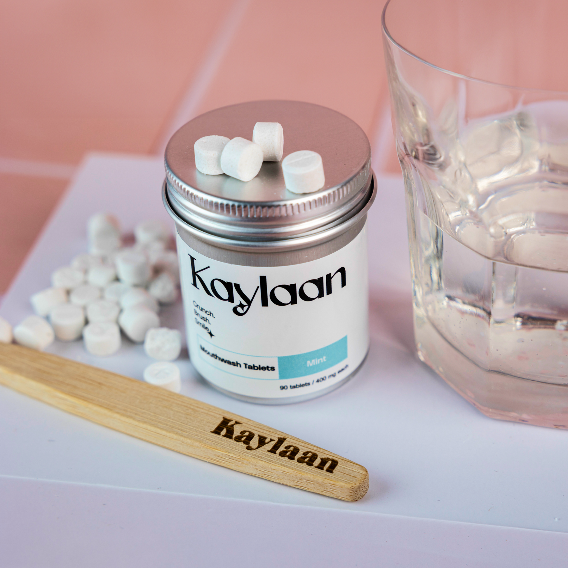 Kaylaan mint mouthwash tablets in a white jar with silver lid and round tablets