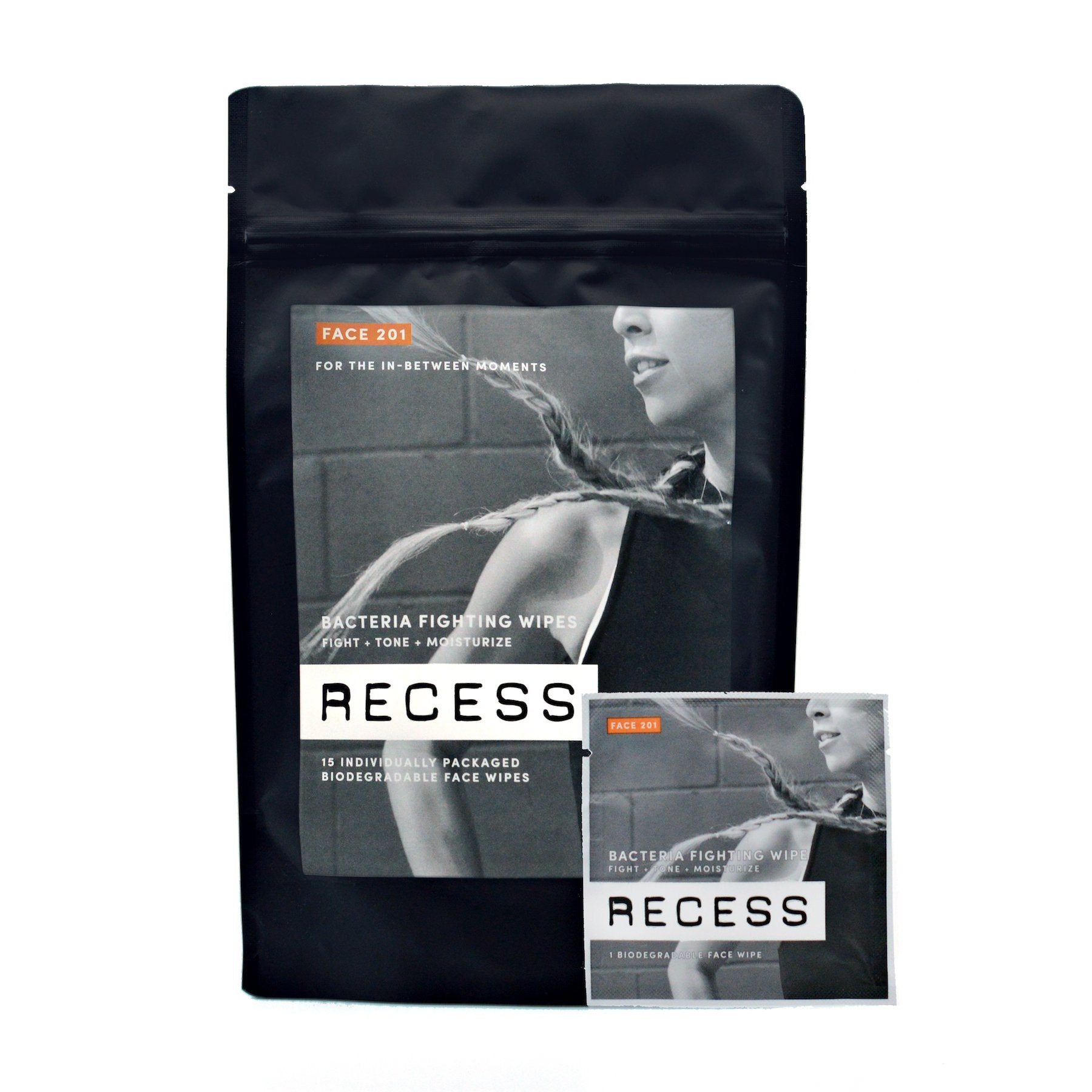 Biodegradable face wipe pouch with smaller sachet beside it, black RECESS design