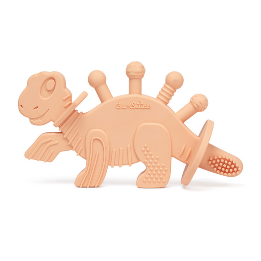 Peach-colored dinosaur-shaped teething toy on a white background